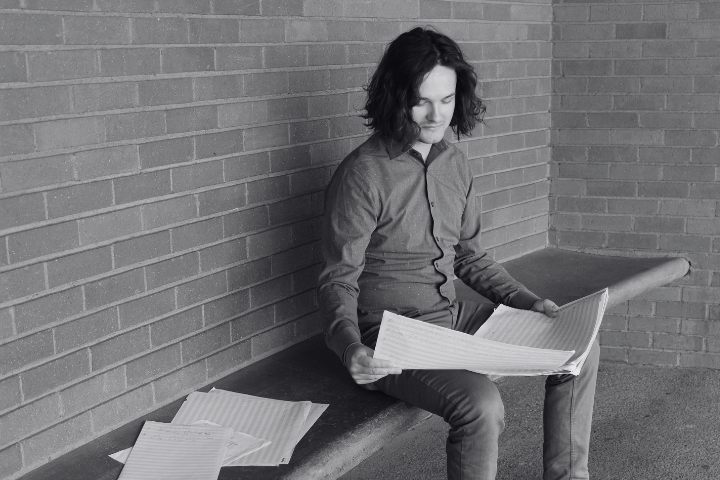 handsome guy reads paper